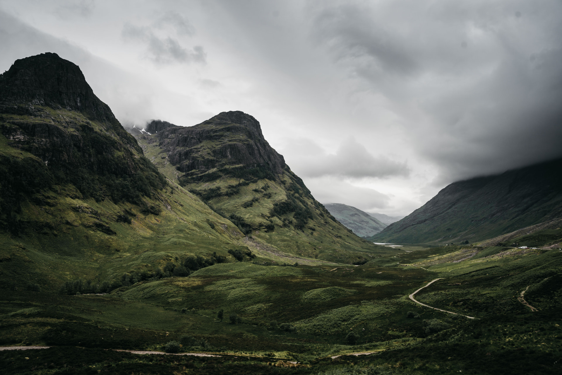 Mountain valley in Glencoe beneath a cloudy sky