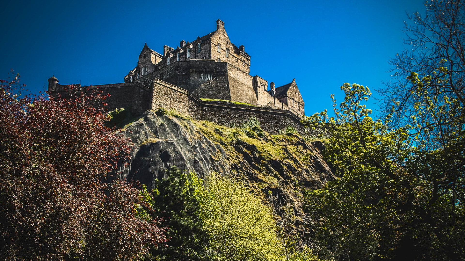 Edinburgh Castle on its rock under a blue sky